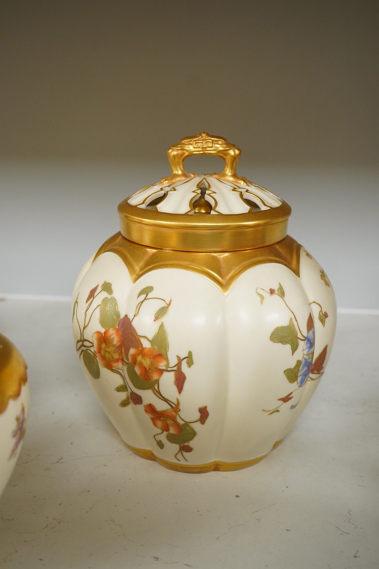 Three 19th century Worcester blush ivory potpourri or biscuit jars and covers, two with liners, each decorated with flowers and buds, largest 20cm high